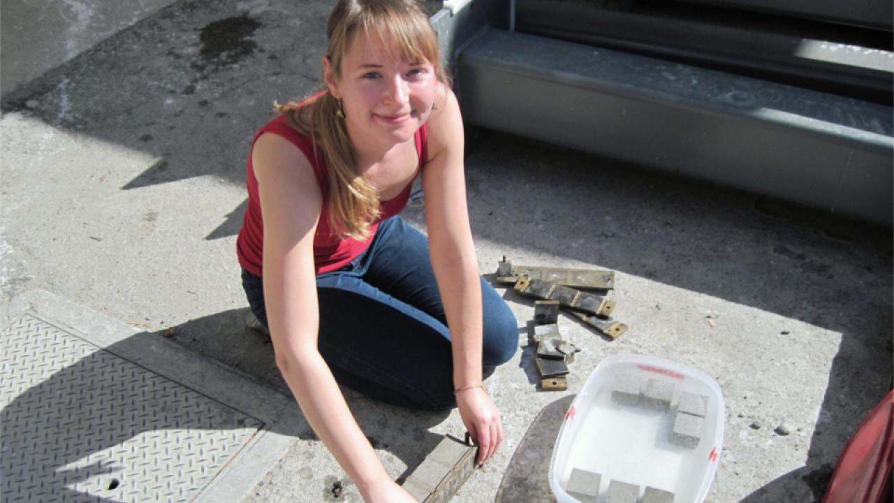 Chiara McKenney holding mortar blocks.