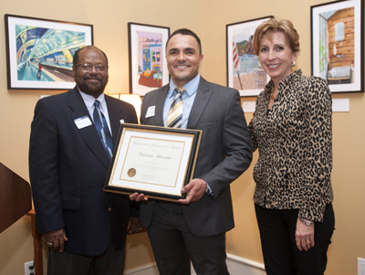 Cristian receiving the 2014 Chancellor’s Achievement Award for Diversity and Community from Dr. Rahim Reed and Chancellor Katehi