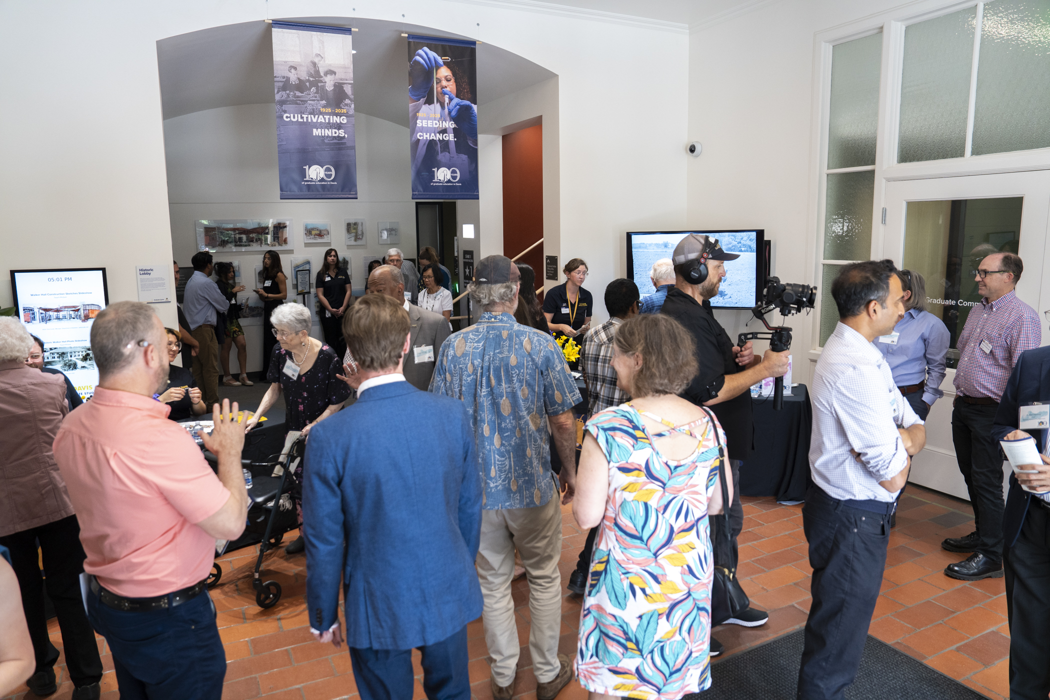 Centennial Showcase attendees mingling in North Lobby inside Walker Hall.