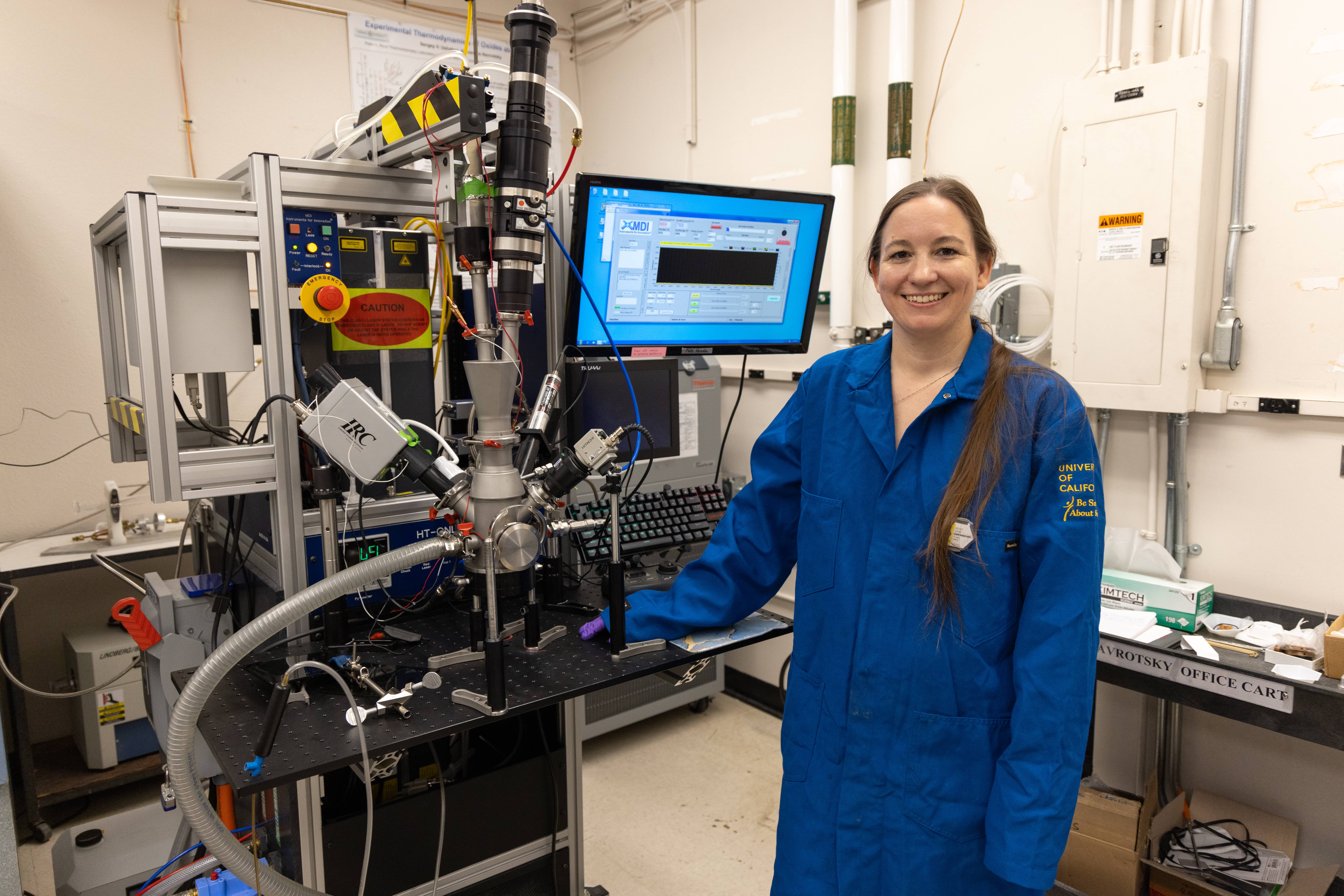 O'Shea poses with the conical nozzle levitation, or CNL, system at UC Davis. (Mario Rodriguez/UC Davis)