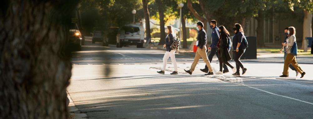 Envision Students walk along campus for a tour