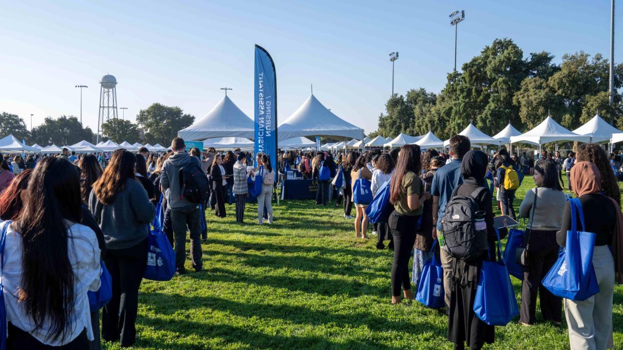 Attendees in line to meet with exhibitors during Pre-Health Fair.