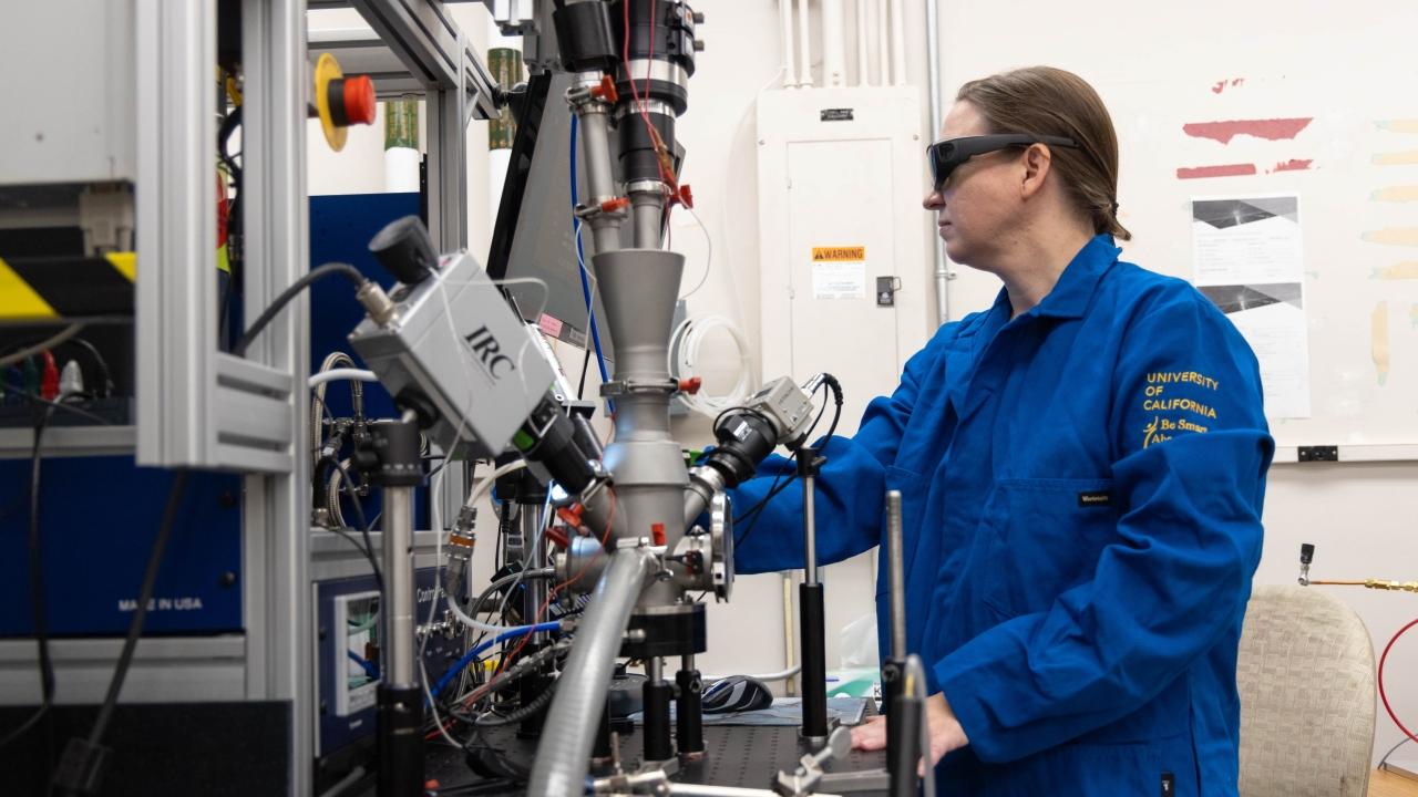 Nicole O'Shea, a Ph.D. student in materials science and engineering at the University of California, Davis, uses the university's conical nozzle levitation system to test the melting point of ternary metal alloy systems. (Mario Rodriguez/UC Davis)
