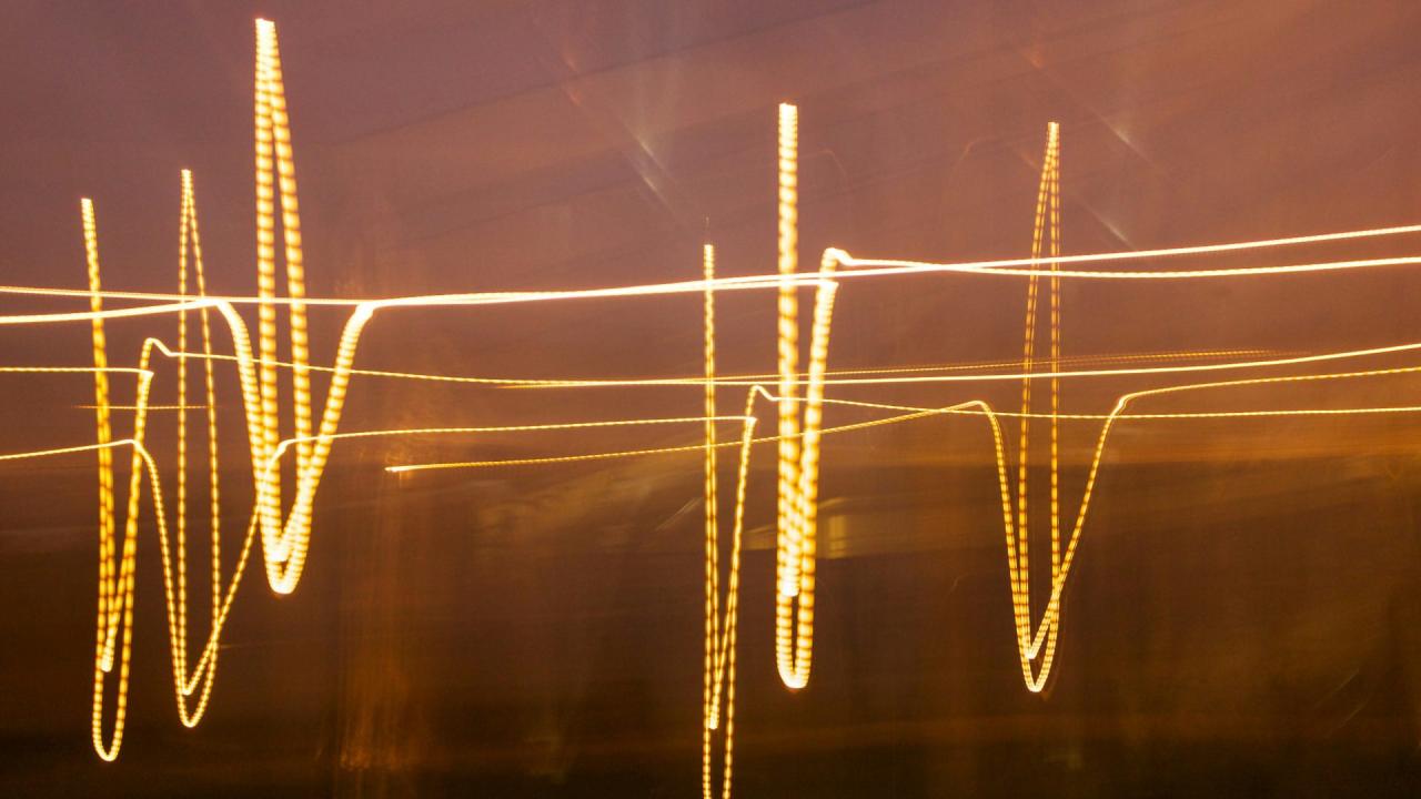 Blurry lights shaped in a heart monitor pattern