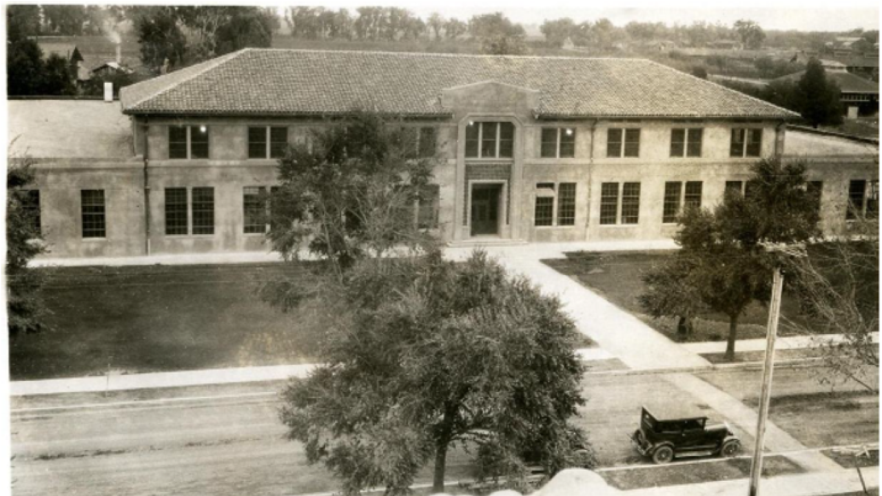 A historic black and white photo of Walker Hall from the 1920s