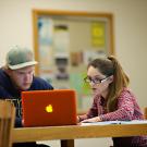 Left to right: Ryan Newland, a junior Managerial Economics major works on his Calculus homework with his tutor, Alicia Fiebig, a Math graduate student in the lobby of Shields Library on the UC Davis campus.