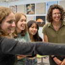  Claire Murphy (right), a Ph.D. candidate in the Population Biology Graduate Group, mentors a group of UC Davis undergraduates in Storer Hall. Murphy was honored with the 2025 CBS Dean’s Mentorship Award for her dedication to fostering inclusion and curiosity in science through hands-on research and guidance. (Katrina Huynh/UC Davis)