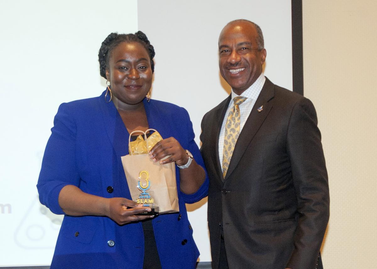 UC Davis GSADC Mayowa Adegboyega with Chancellor Gary May