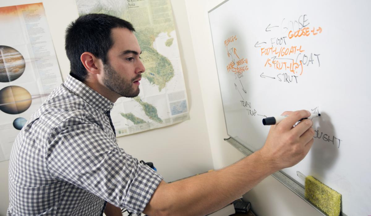 Villarreal writing on a whiteboard