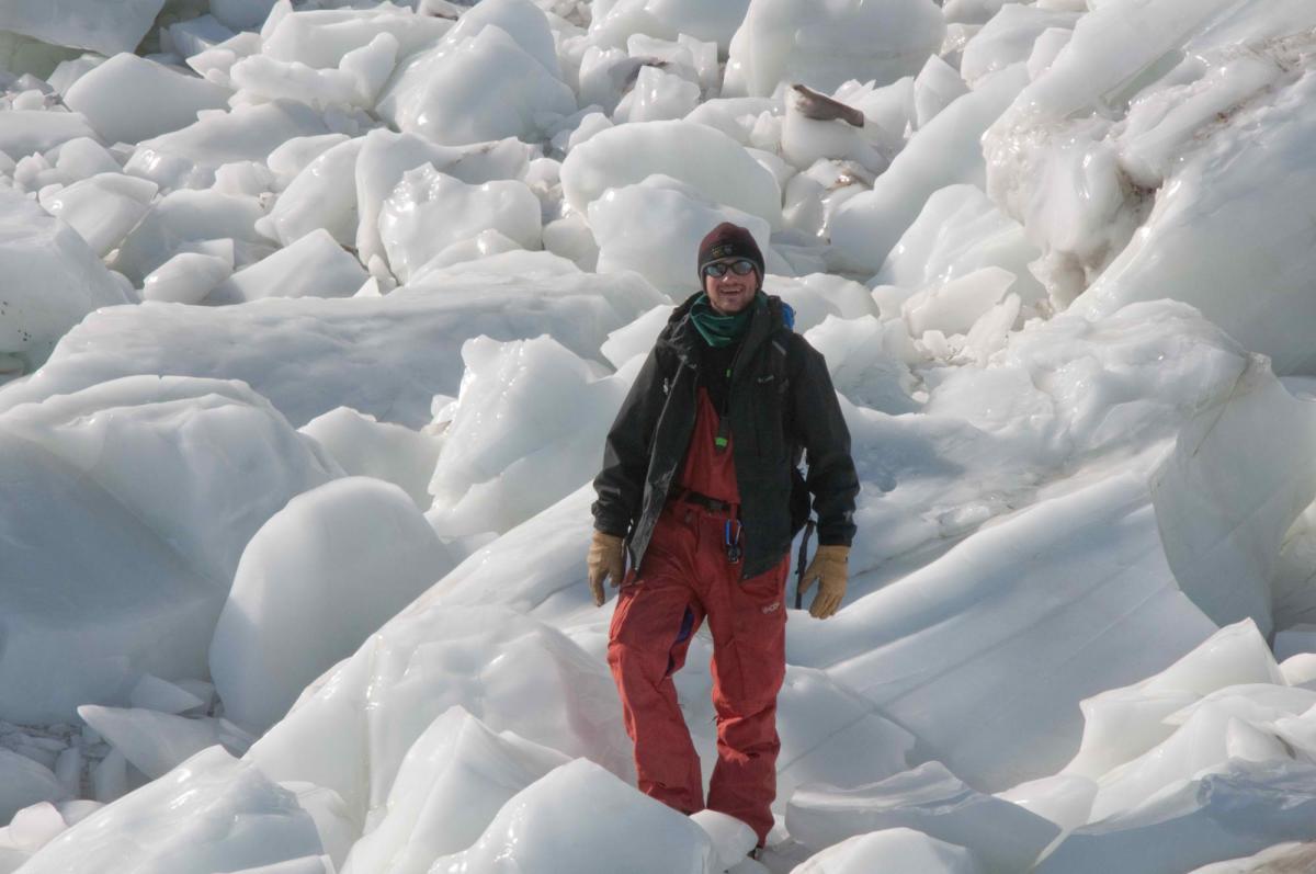 Tyler Mackey on an ice field in Antartica