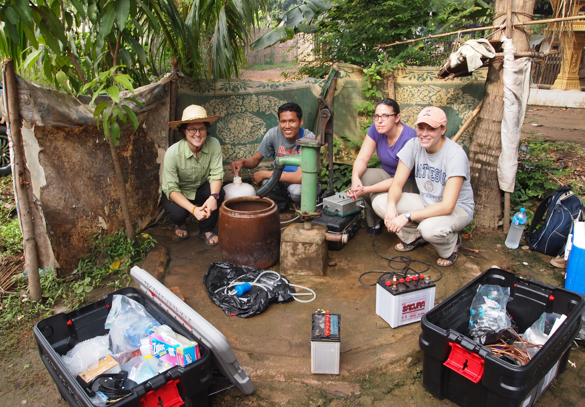 Markovich and 3 colleagues sampling well water in Cambodia